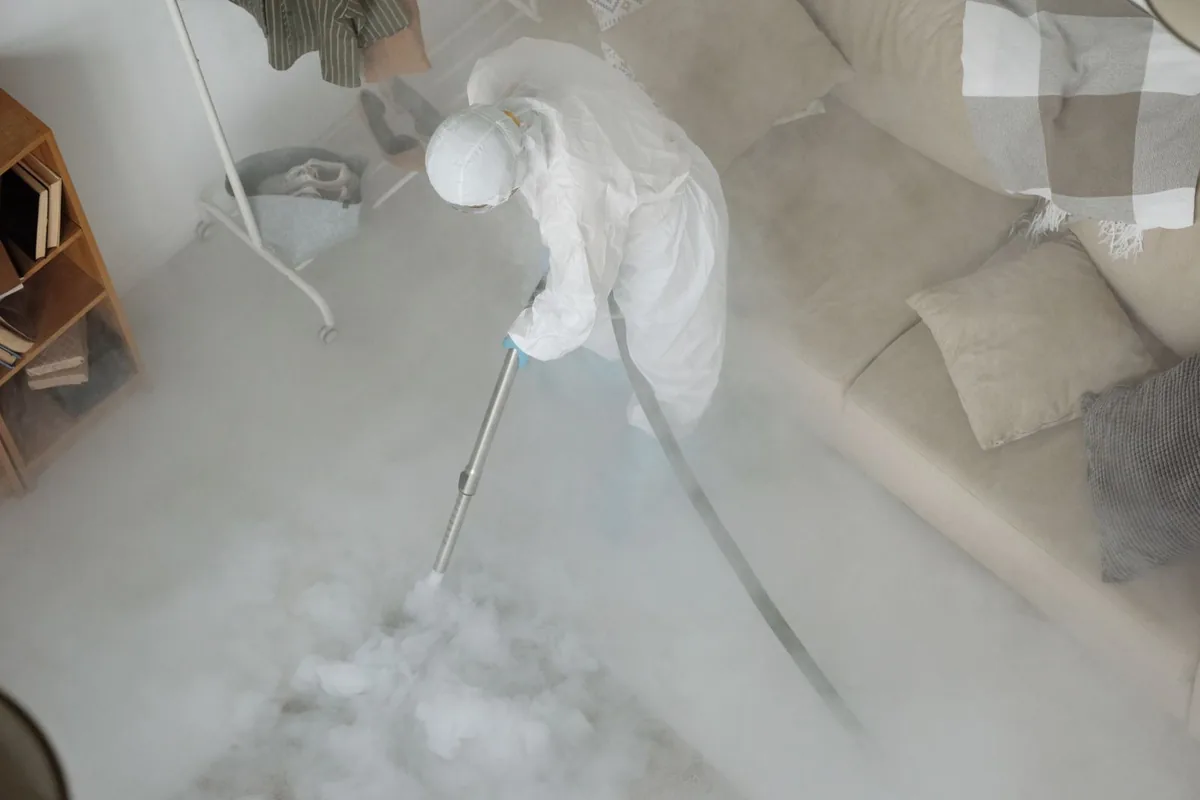Biohazard cleanup technician in protective equipment, Eastpointe, MI